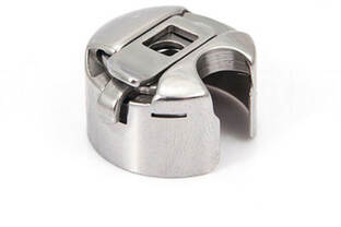 Accessoire pour machine à coudre industrielle en métal.